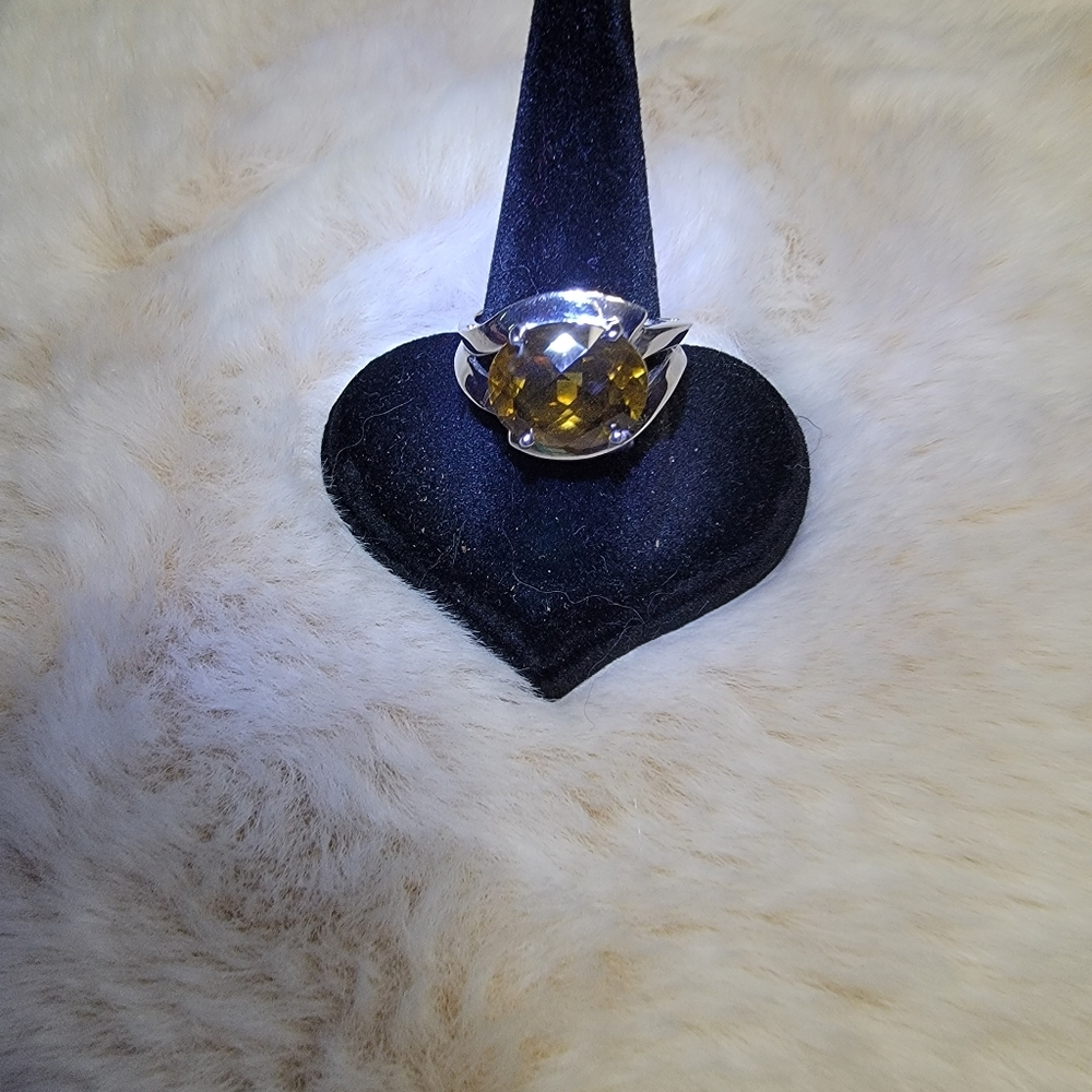Cognac citrine ring set in SS.  Size 7.